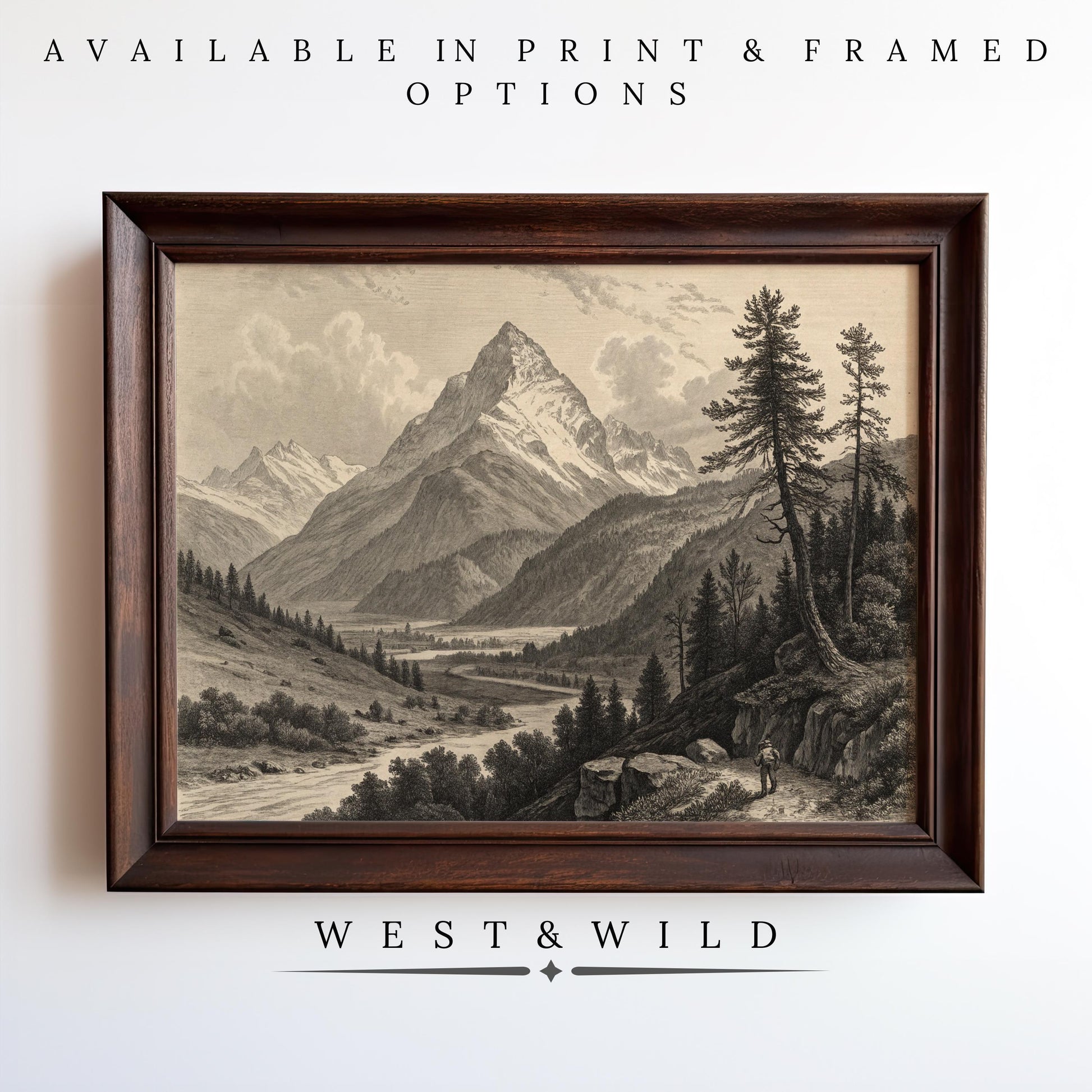 A framed Vintage Mountain Wall Art hangs on a white wall. Text above reads, Available in print & framed options. Below the frame: West & Wild Art Archive. Product: Classic Mountain Print Framed Artwork, Antique Landscape - Vintage Art Prints & Framed Art.