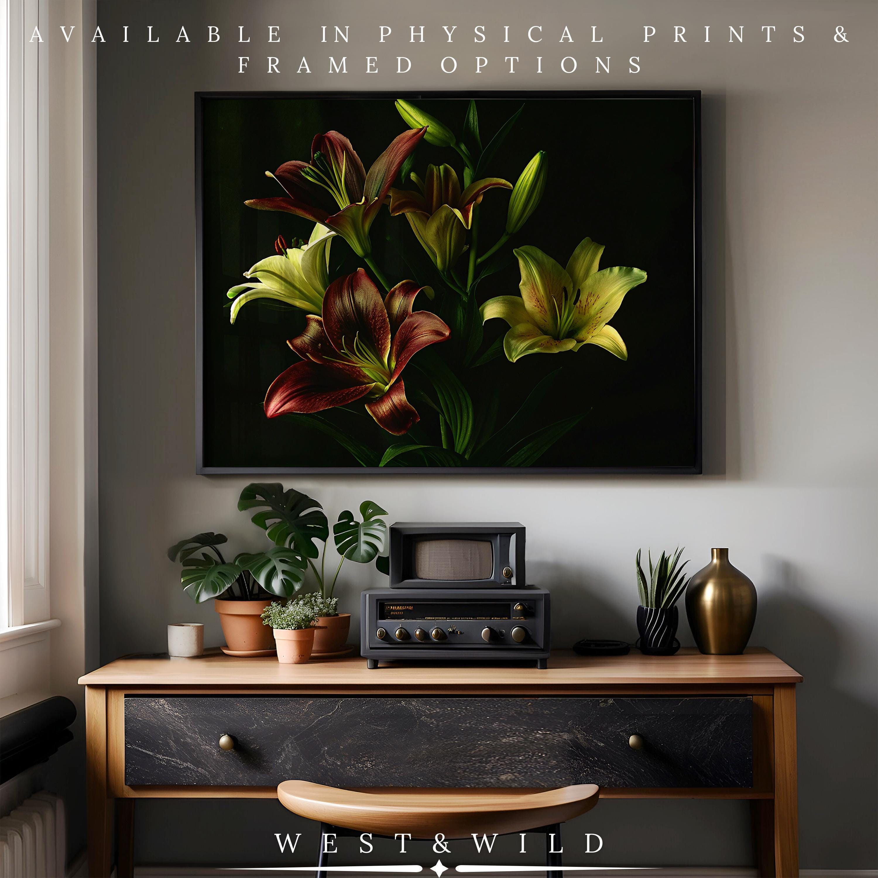 A framed Peony Flower Painting—elegant botanical wall art with yellow and burgundy blooms—hangs above a vintage radio on a wooden console with plants in a modern space. Available as vintage art prints & framed art by West & Wild.