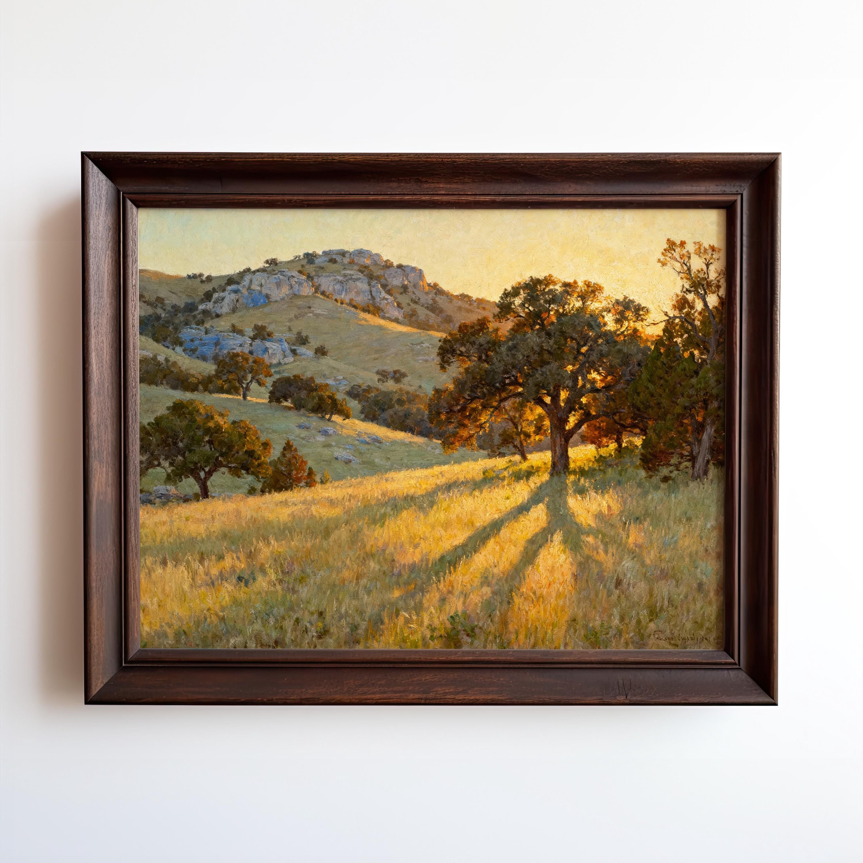 The image is a framed painting depicting a serene landscape with a large tree casting a shadow on the grassy hill, surrounded by mountains and hills.
