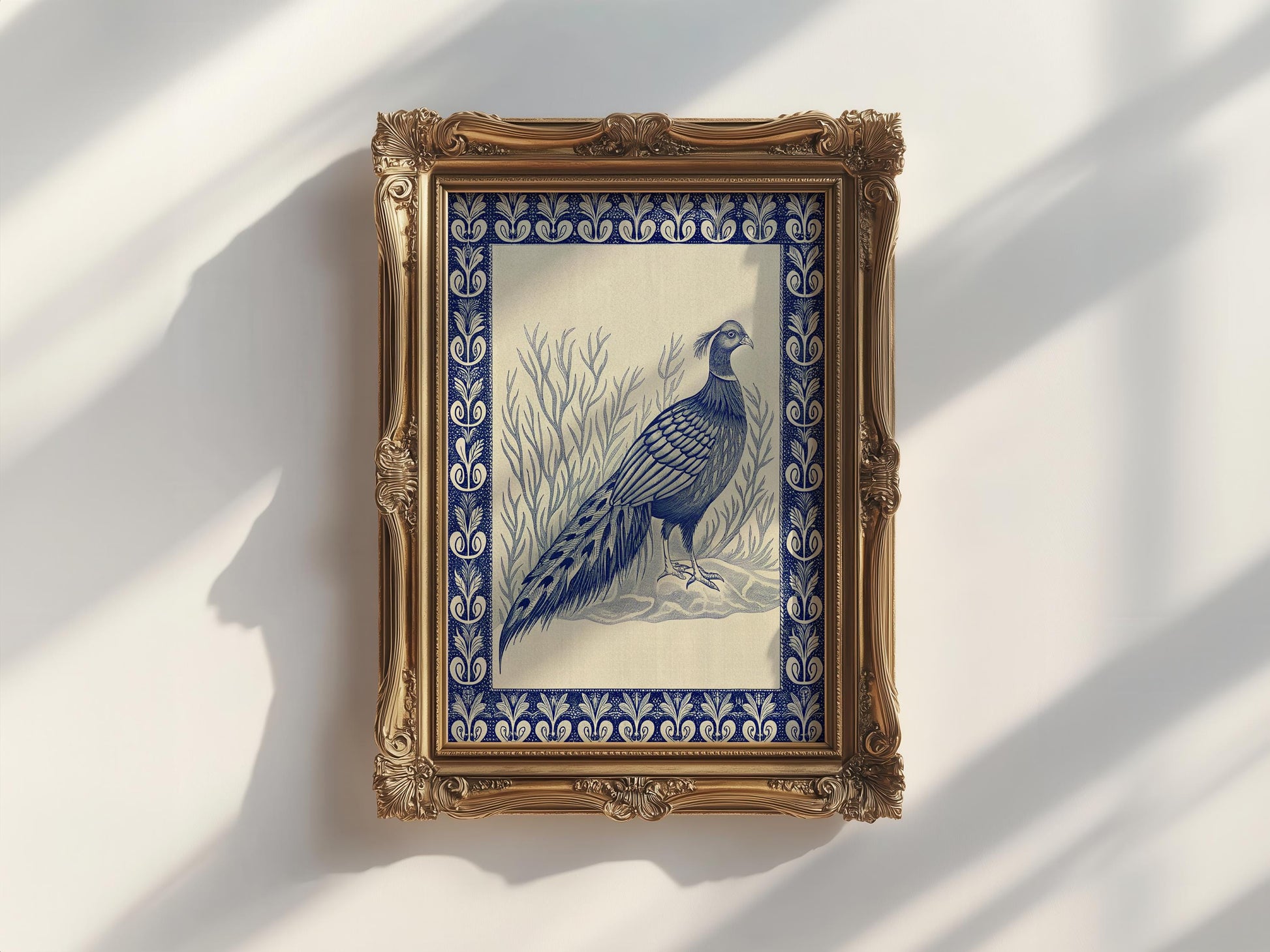 The Vintage Pheasant Wall Art features a blue-tone pheasant among grass, set in an ornate gold frame. This archival-quality, framed indigo bird artwork is from West & Wild Art Archive’s vintage art prints collection.