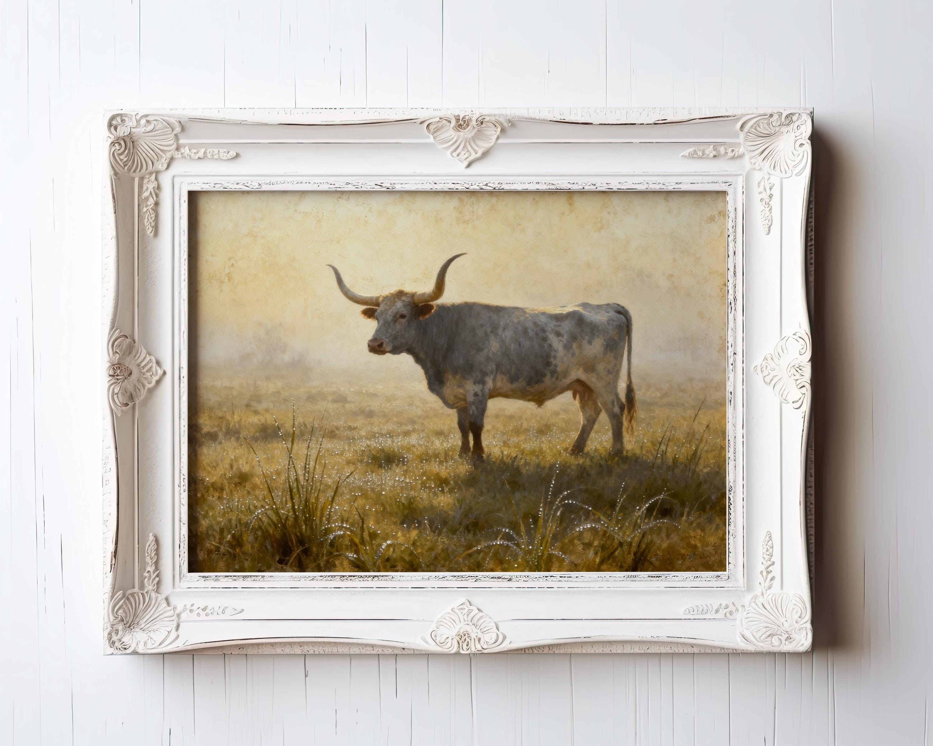 A framed painting of a bull standing in a field with tall grass.