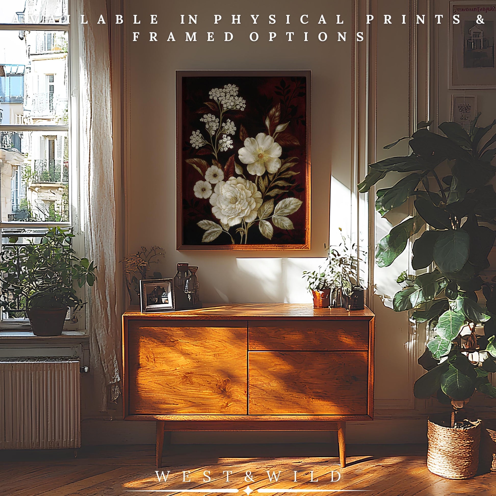 A bright room with a mid-century wooden sideboard, plants, framed photos, and a floral painting. Showcase the "Vintage Botanical Print – Dark Floral Art | White Roses & Queen Anne's Lace" in West & Wild frames for archival, museum-grade quality.