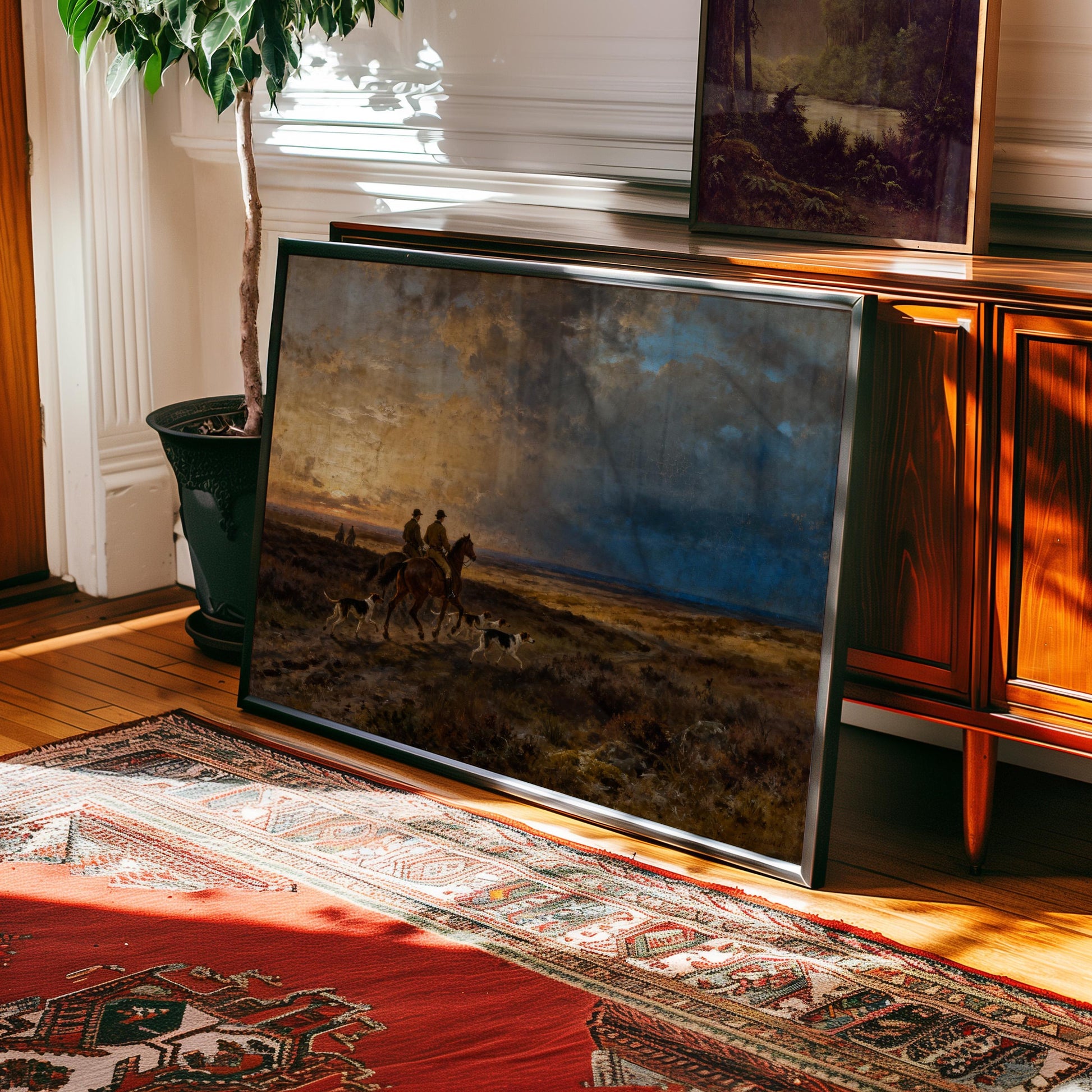 a large painting of a horse-drawn carriage on a field, with two people riding in the carriage and two dogs accompanying them. The painting is displayed on a wooden cabinet, and there is a rug on the floor in front of it.