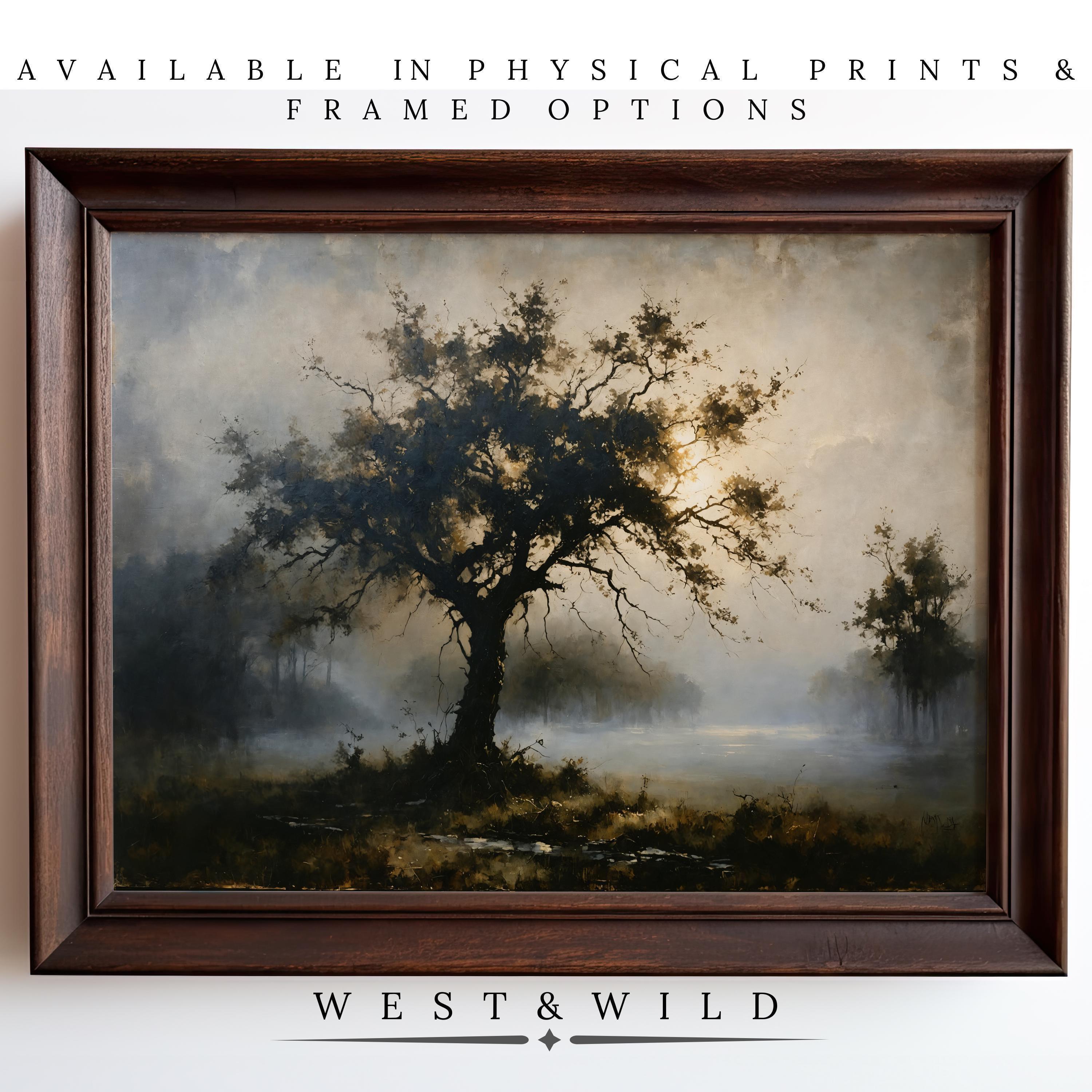 A framed Landscape Artwork Print - Forest Dawn Painting with a moody tree in misty light. Available as archival quality prints and framed art. Perfect rustic home decor. From West & Wild Art Archive.