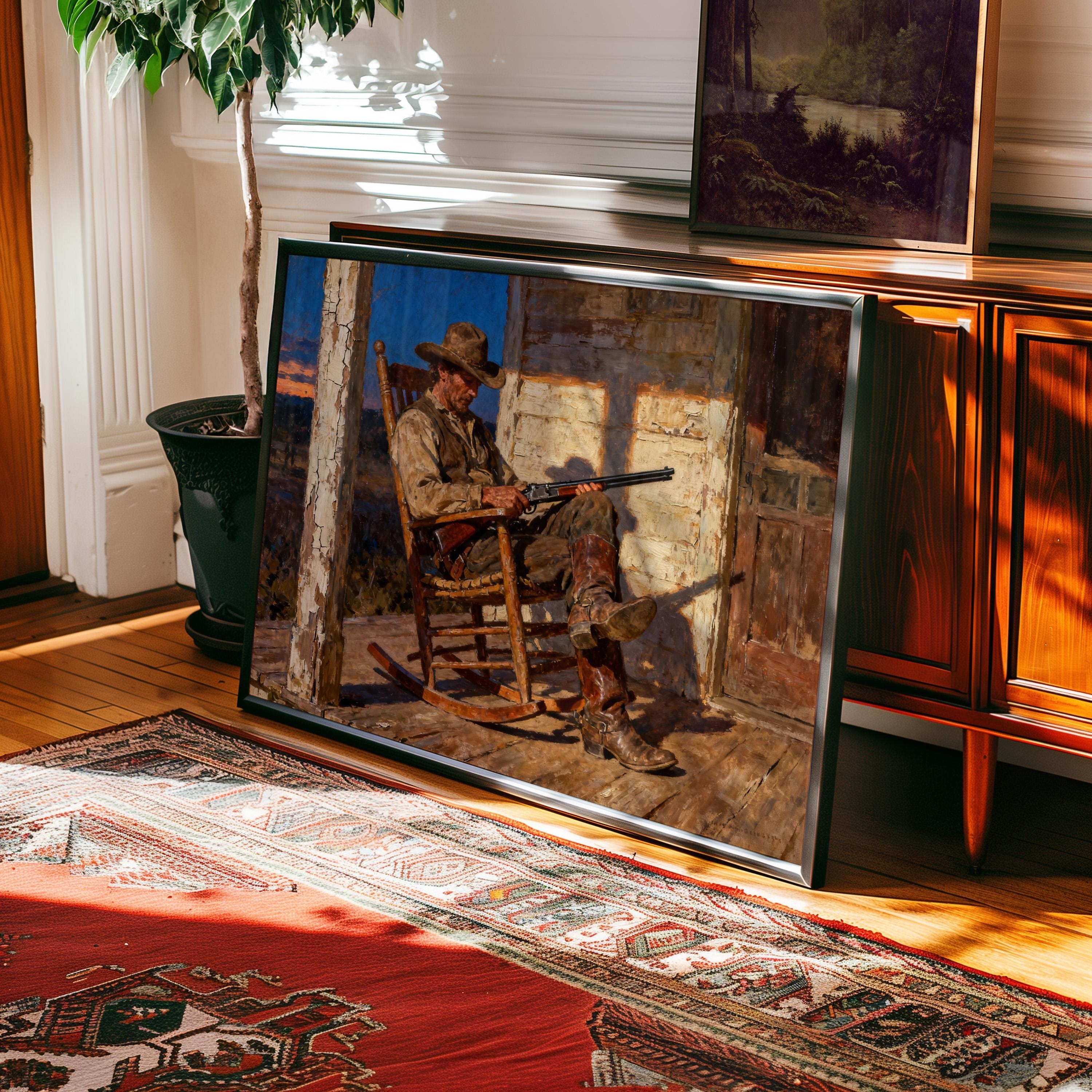 a framed painting of a man sitting in a rocking chair, holding a rifle, with a wooden cabinet and a rug in the background.