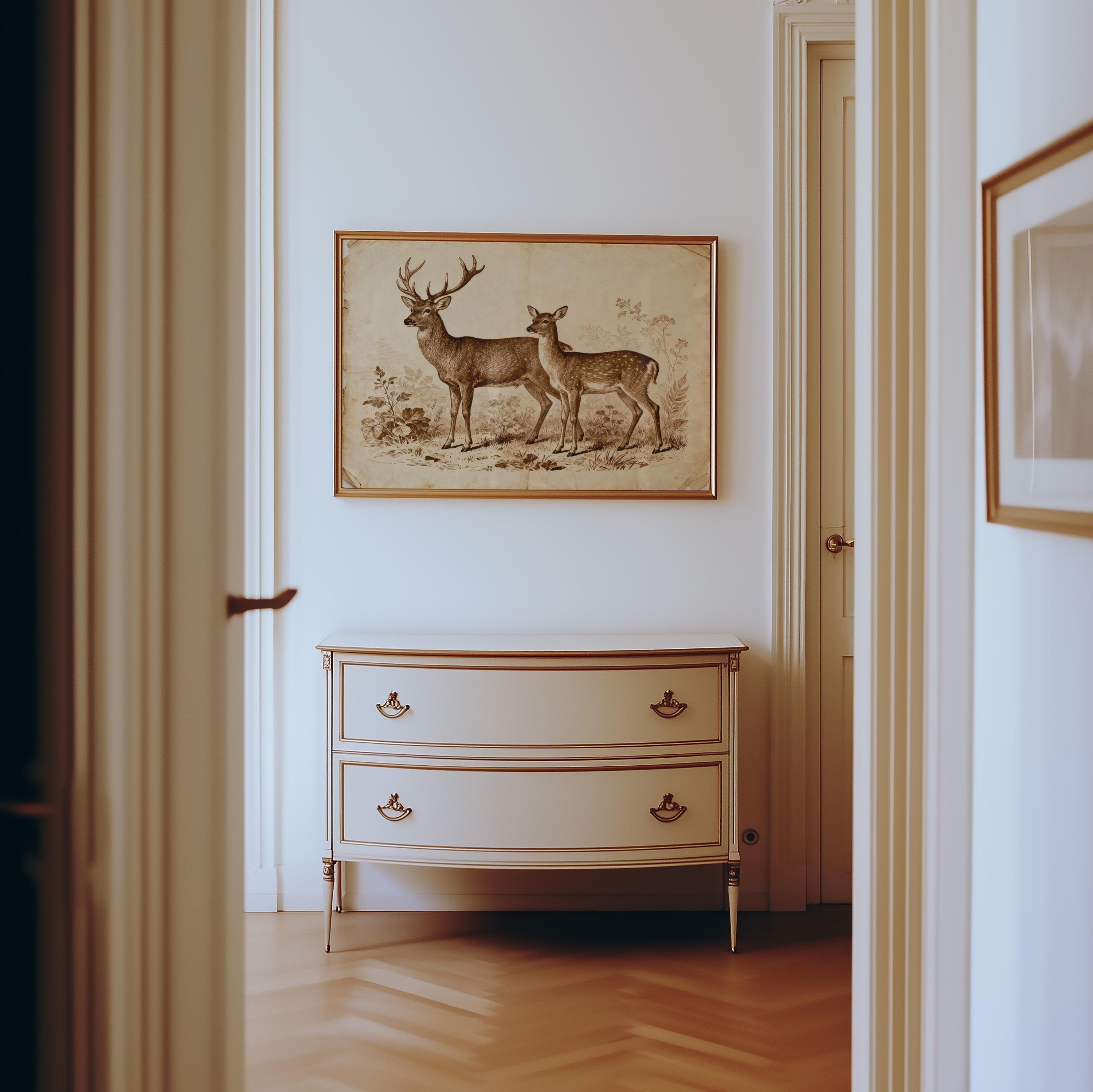 A hallway with light walls and herringbone wood flooring features a cream dresser with two drawers, topped by the Vintage Deer Art Print – Rustic Wildlife Wall Decor With Sepia Tone Illustration for a touch of wildlife charm.