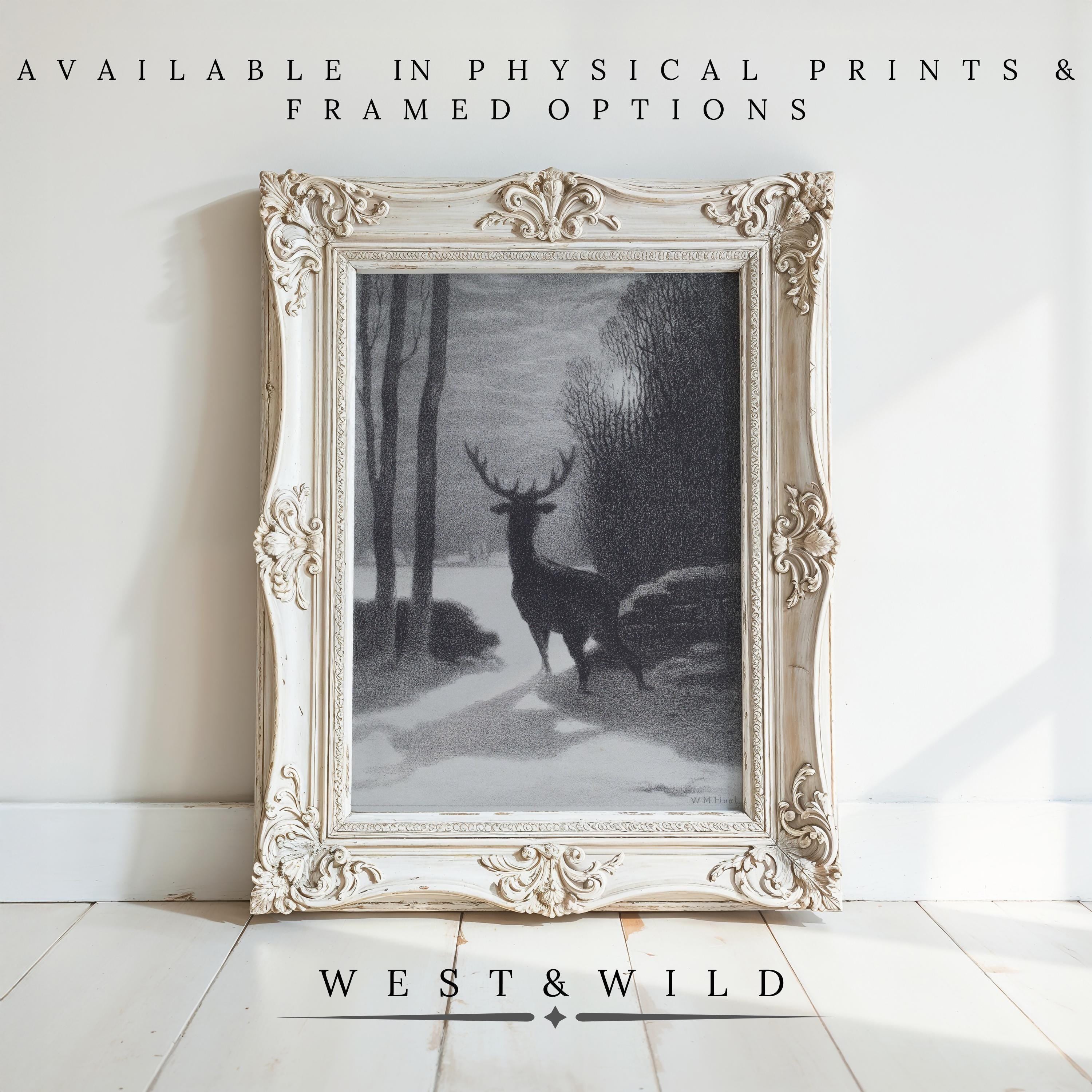 A black-and-white framed “Winter Art Print – Moody Forest Wall Art With Deer | Classic 19th Century Artwork” is displayed on a white wall. Text above reads “AVAILABLE IN PHYSICAL PRINTS & FRAMED OPTIONS”; below: “WEST & WILD ART ARCHIVE.”.