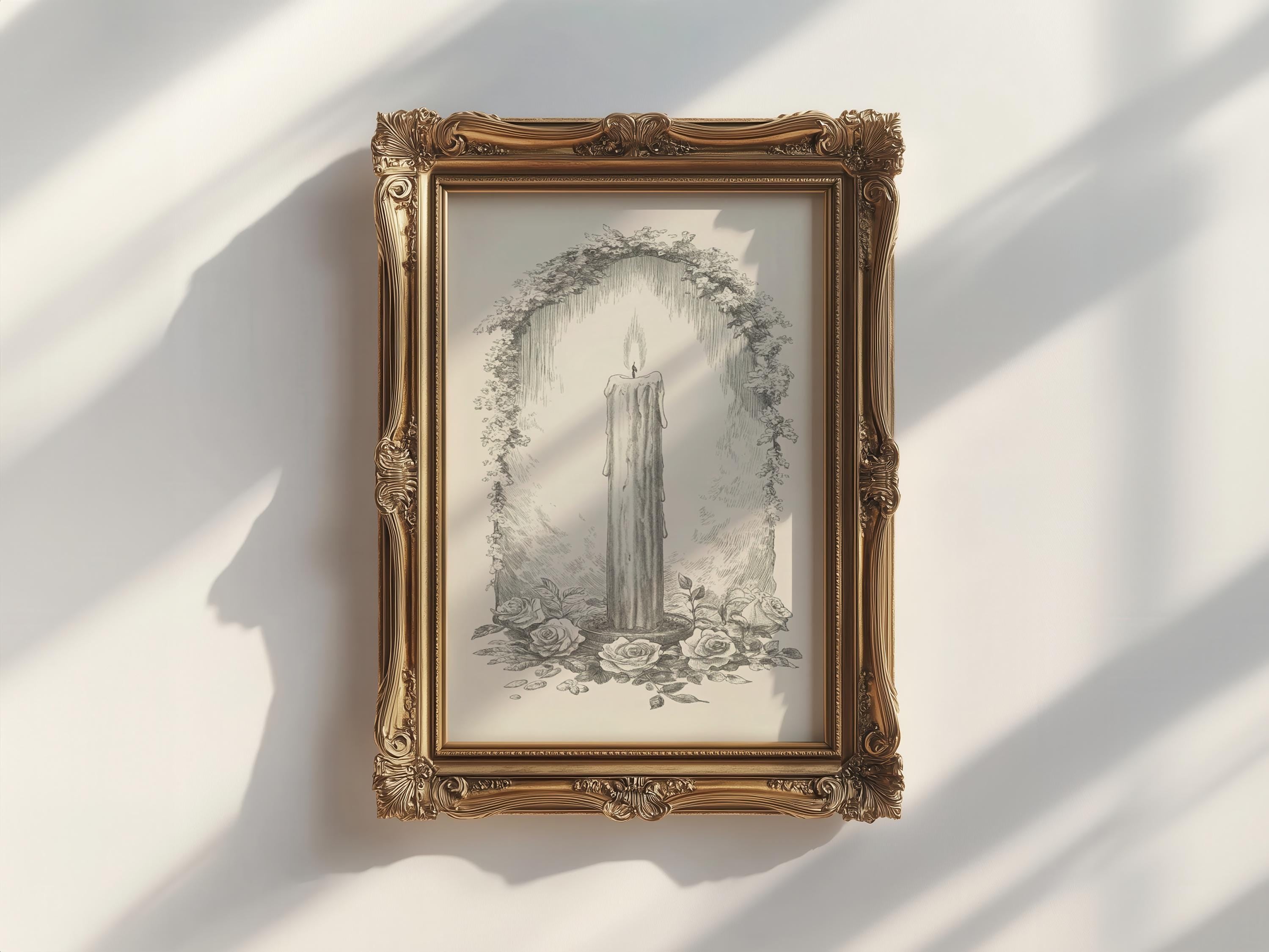 A framed drawing of a candle surrounded by flowers and foliage, hanging on a white wall.