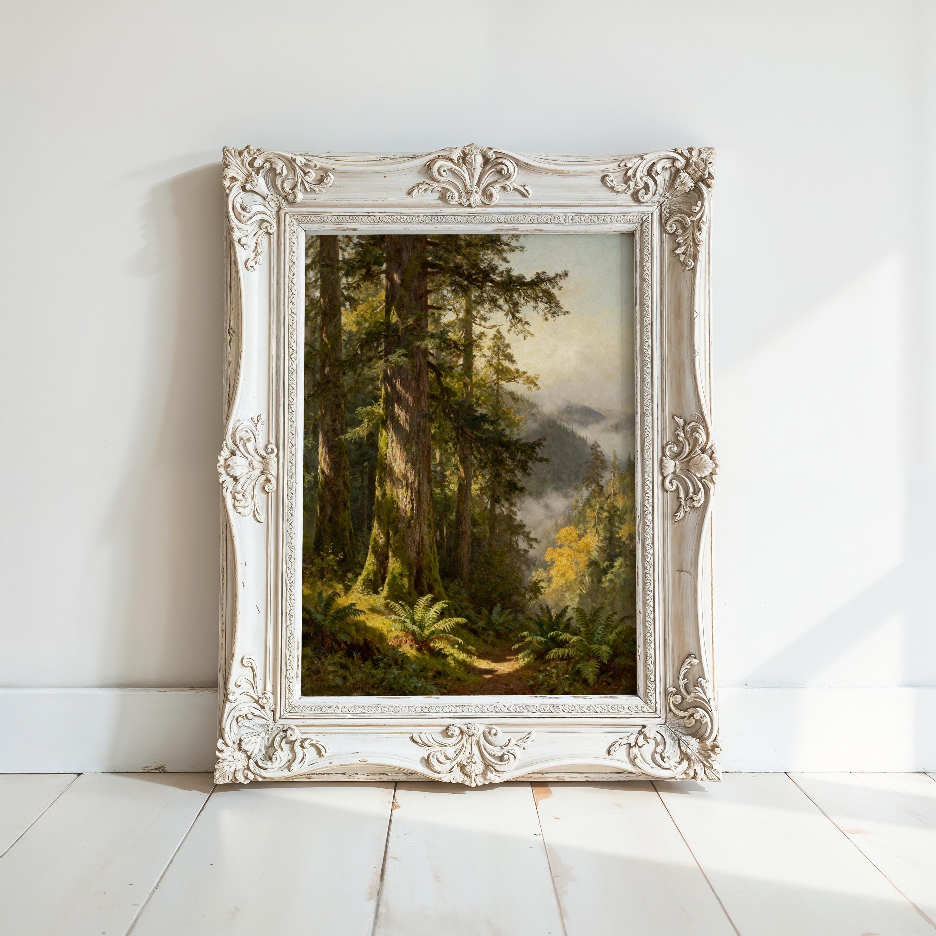 a painting of a forest scene with tall trees and lush greenery, displayed in an ornate white frame on a white wall.