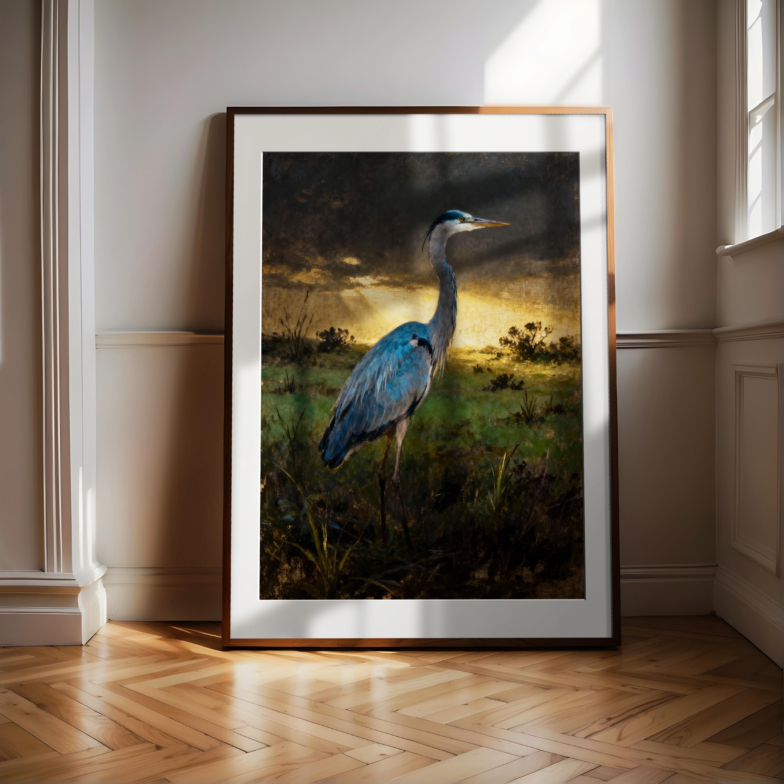 A framed painting of a blue heron standing in a grassy field with a sunset in the background.