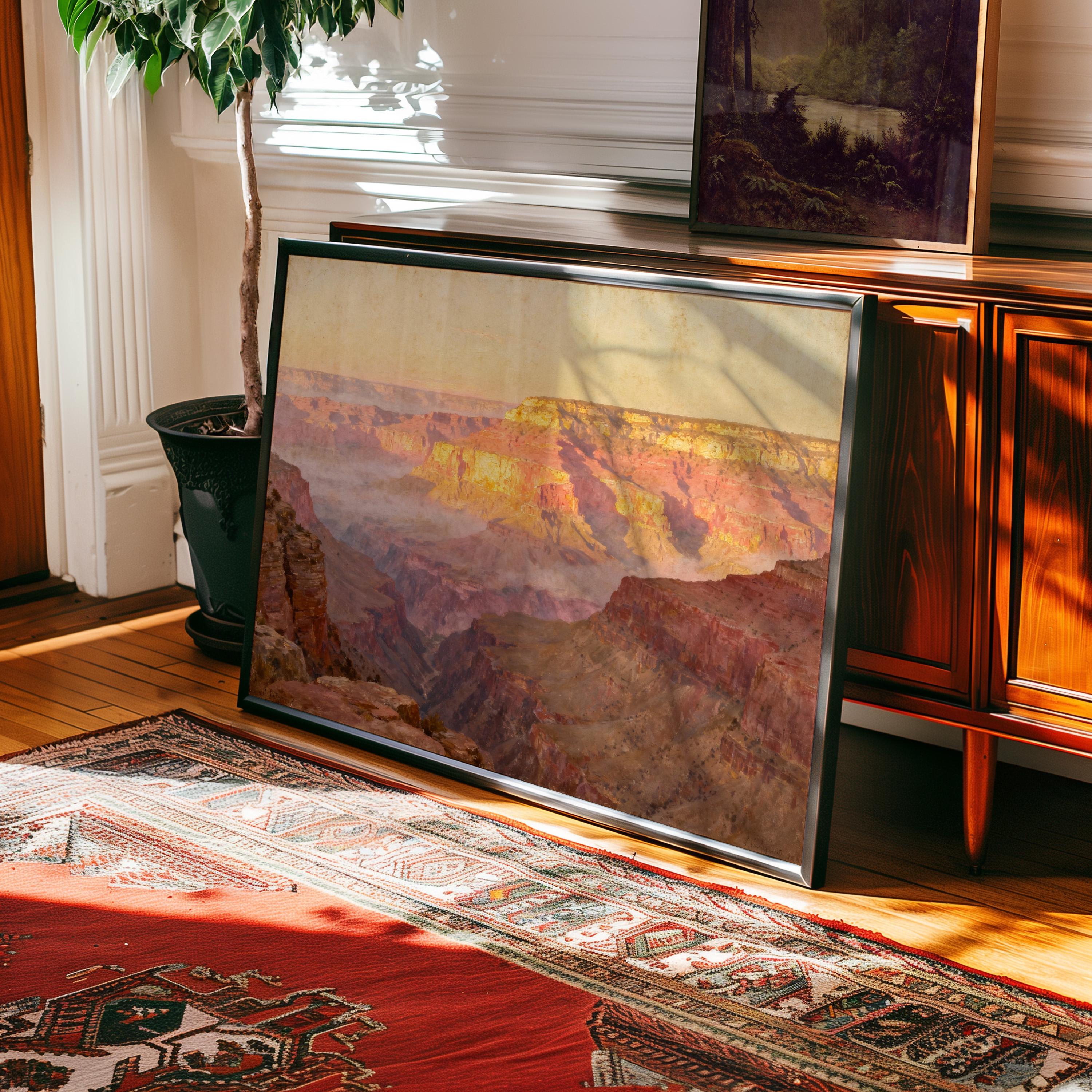 a large framed painting of a mountainous landscape, with a wooden cabinet and a potted plant in the background.