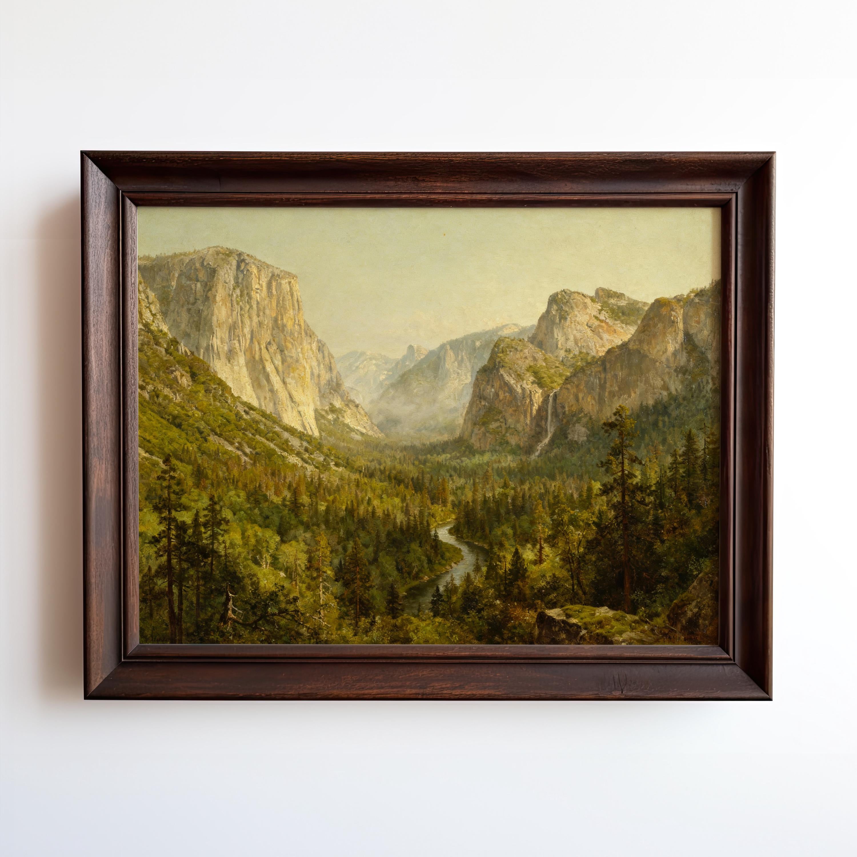 The Yosemite Valley Art Print – Classic American Landscape With River View features a lush, green valley, winding river, and tall mountains. This archival quality framed wall art is displayed in dark wood against a white wall.