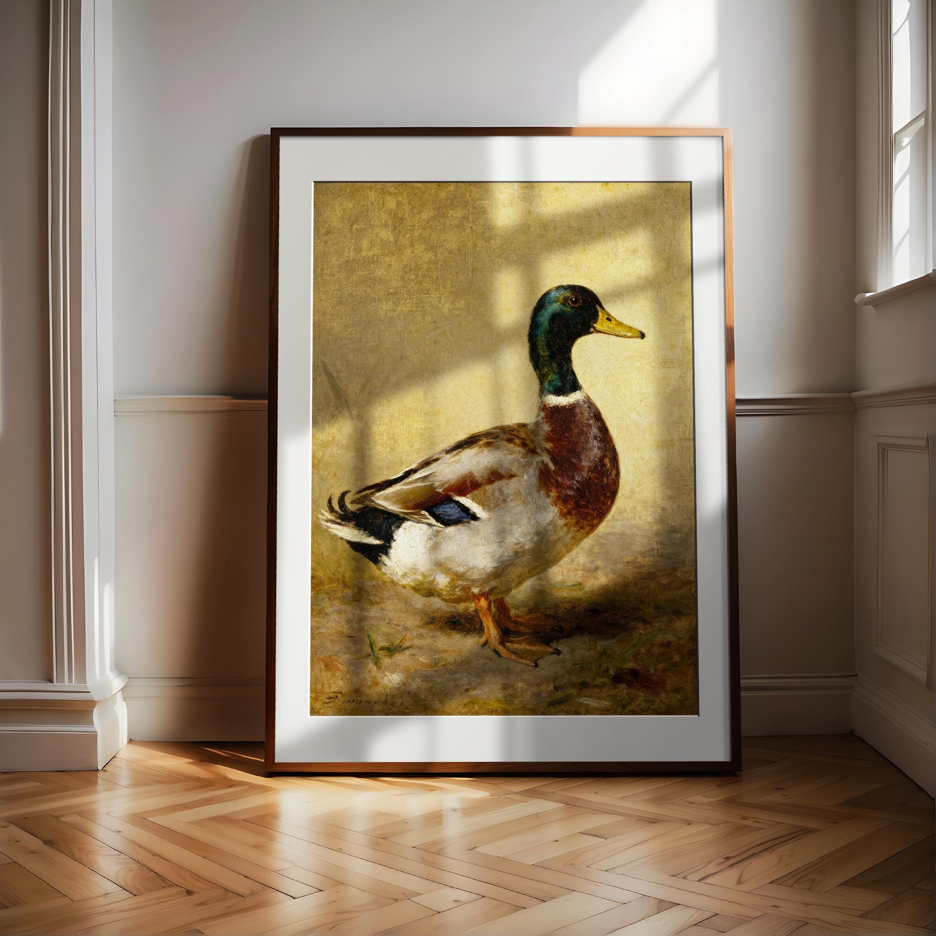 A framed painting of a duck is displayed on a wooden floor in a room with white walls.