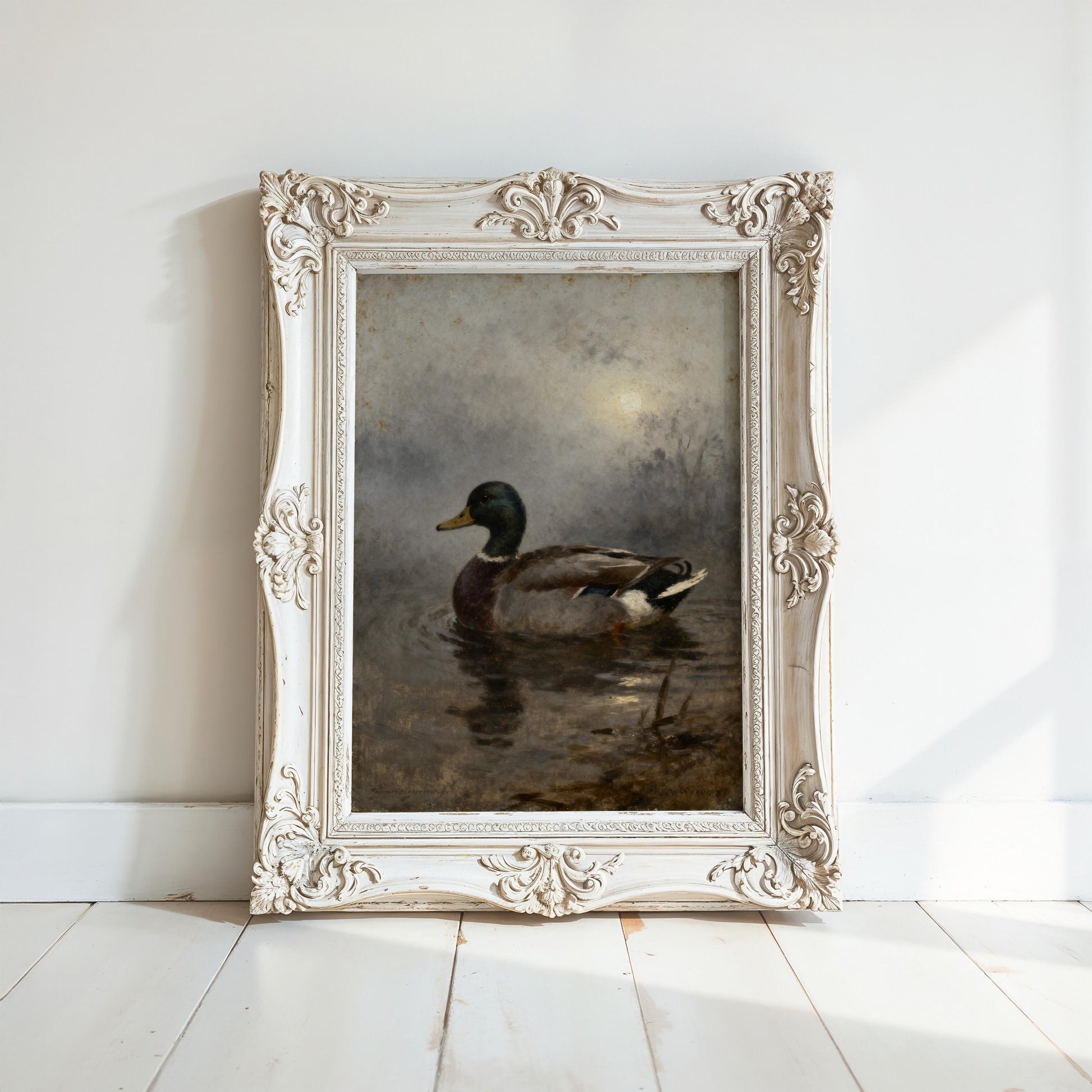 a painting of a duck swimming in a body of water, displayed in an ornate white frame on a white wall.