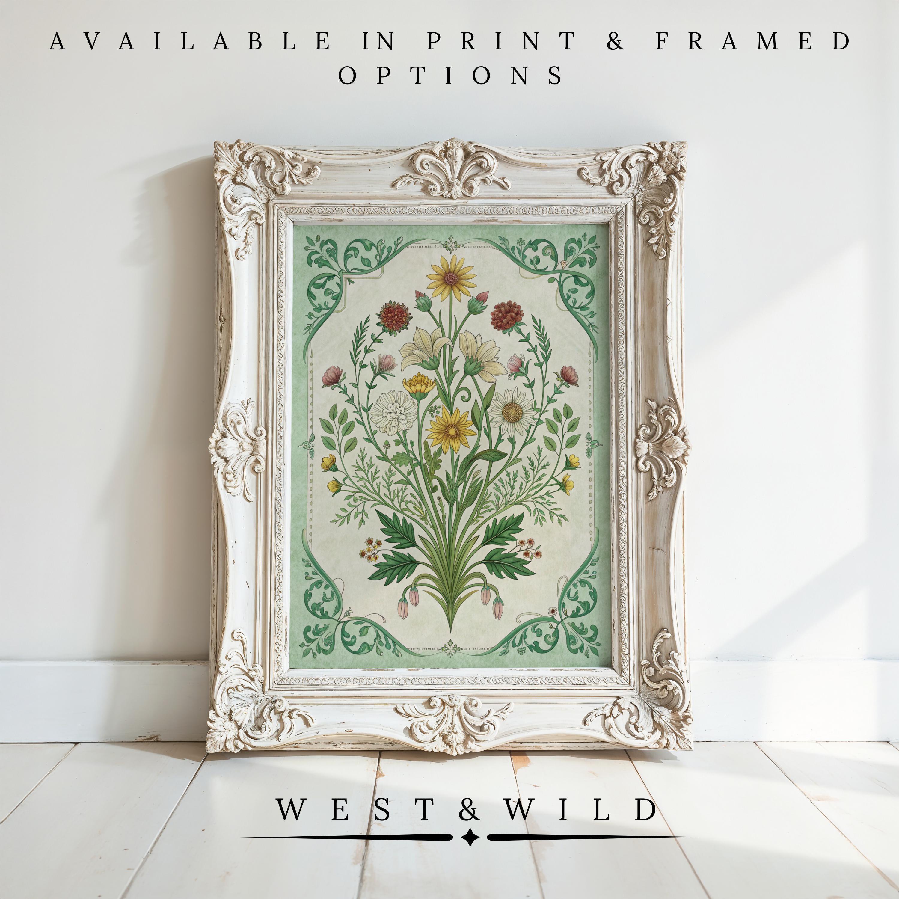 The Vintage Botanical Wall Prints – Victorian Floral Artwork Framed Flower Prints from West & Wild are displayed in an ornate white frame on a white floor, with text above: Available in print & framed options. Brand: West & Wild.